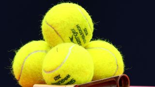 LONDON, ENGLAND - JUNE 12: Wimbledon tennis balls sit ready on the Queens Club practice court at The Queen's Club on June 12, 2025 in London, England.