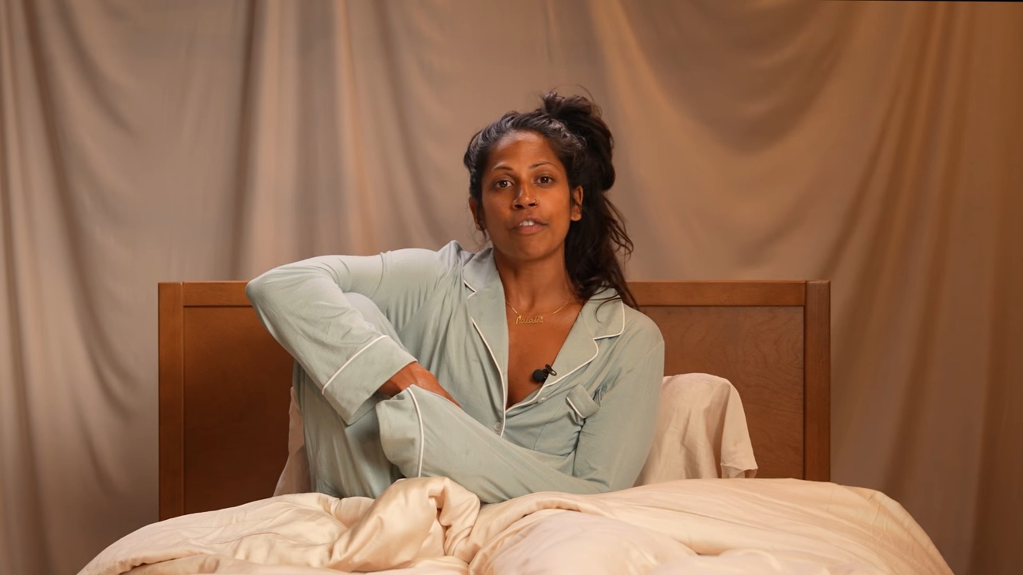 Natalie Anderson talking on a bed in Bed Rot Challenge. 