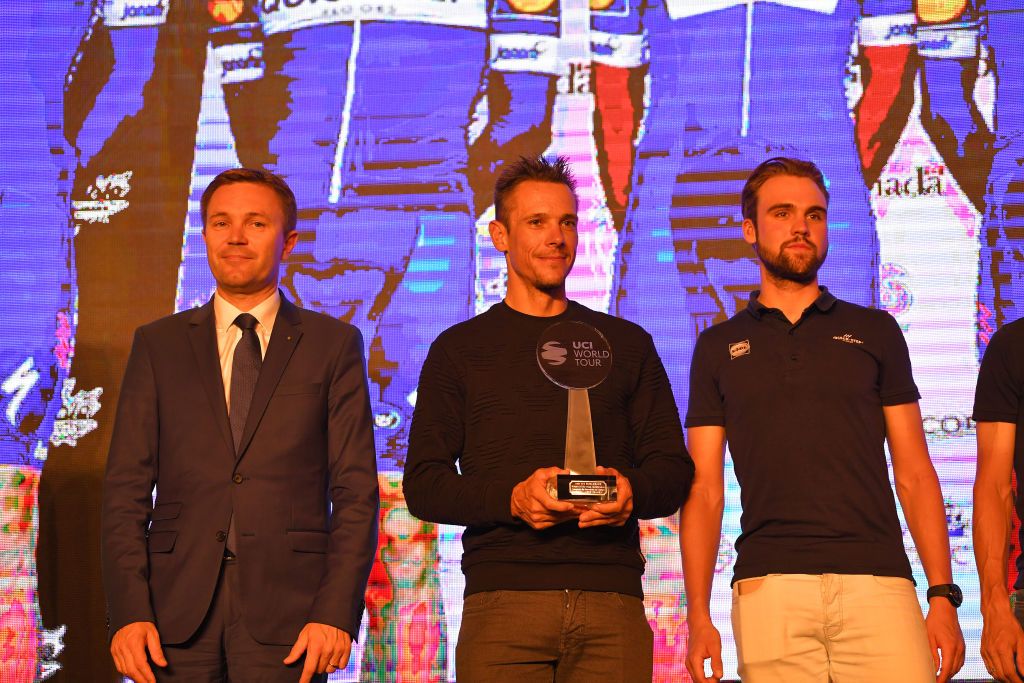 Philippe Gilbert holds Quick-Step's trophy for 2018 WorldTour teams classification champions