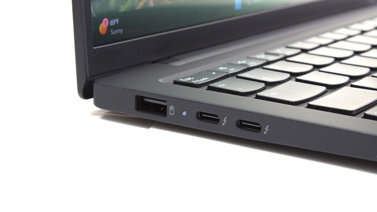 A close up of connectivity ports on the side of a laptop.