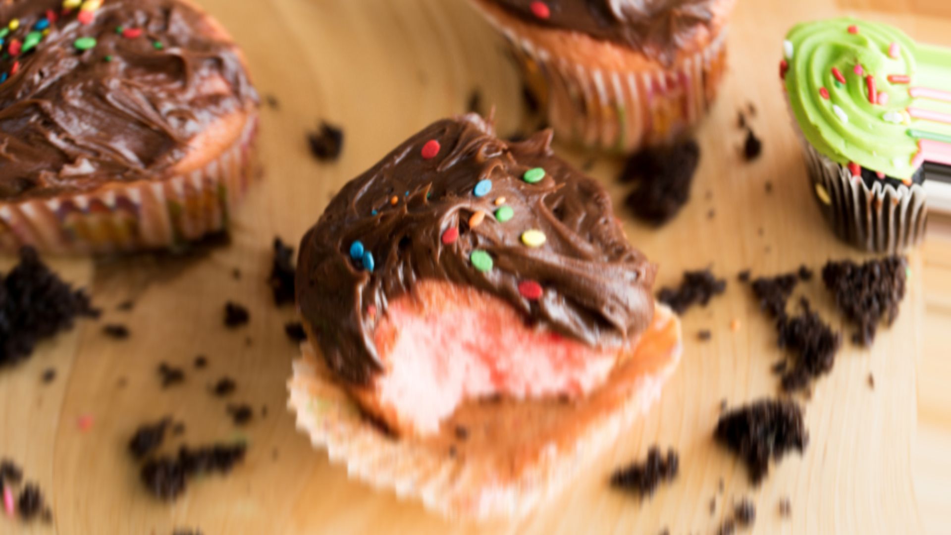 A cupcake with a bite taken out of it by AMBERORDONEZ that has been distorted to make it look more like the picture I would take