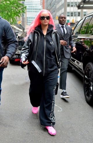 Rihanna departs for Miami with pink hair teasing her Met Gala 2024 look