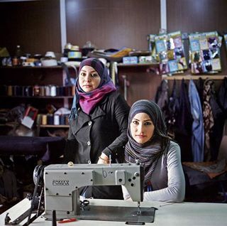 Amira Youssef, 22 (left), and Zeinab Dagher, 20, support their families by working as seamstresses, making $3 a day.