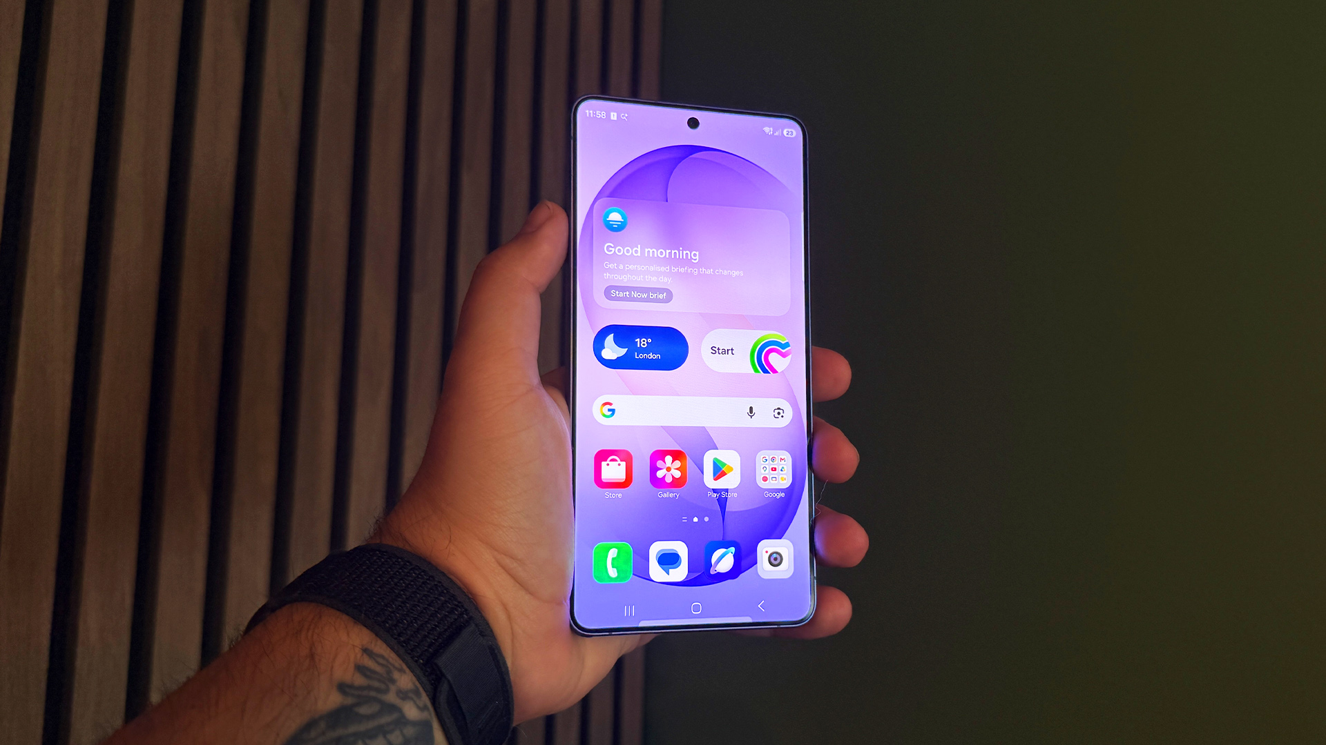 Samsung Galaxy S26 Ultra smartphone held in hand with apps on screen