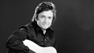 Johnny Cash with his guitar in 1974