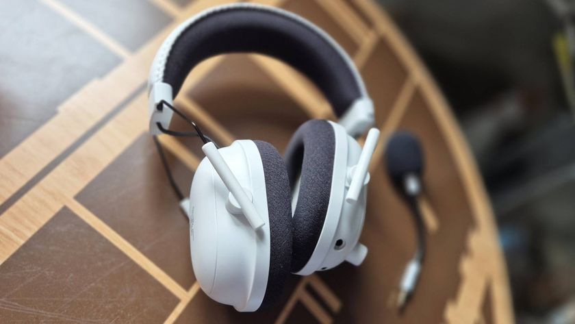 Photo by Rosalie Newcombe of the PlayStation version of the Razer BlackShark V2 Pro sitting on a coffee table.