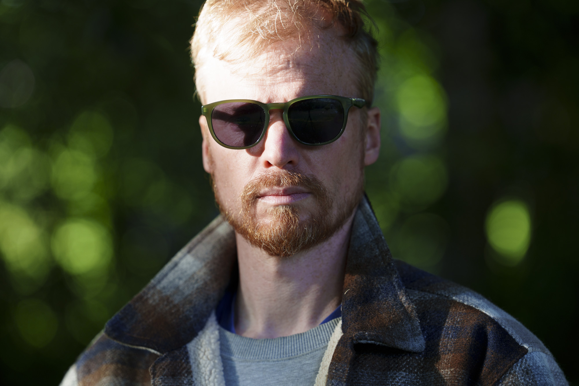 Head and shoulder portrait of a man in sunglasses and jacket, taken with the Sony FE 50-150mm F2 GM lens, taken with the Sony FE 50-150mm F2 GM lens