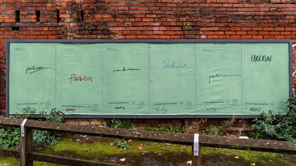 Parkrun billboard with prescriptions that say &#039;parkrun, weekly&#039; in handwriting on them