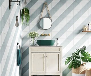 pale green and white diagonally striped tiles in bathroom