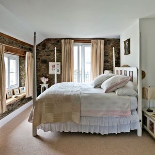 bedroom with white four poster bed