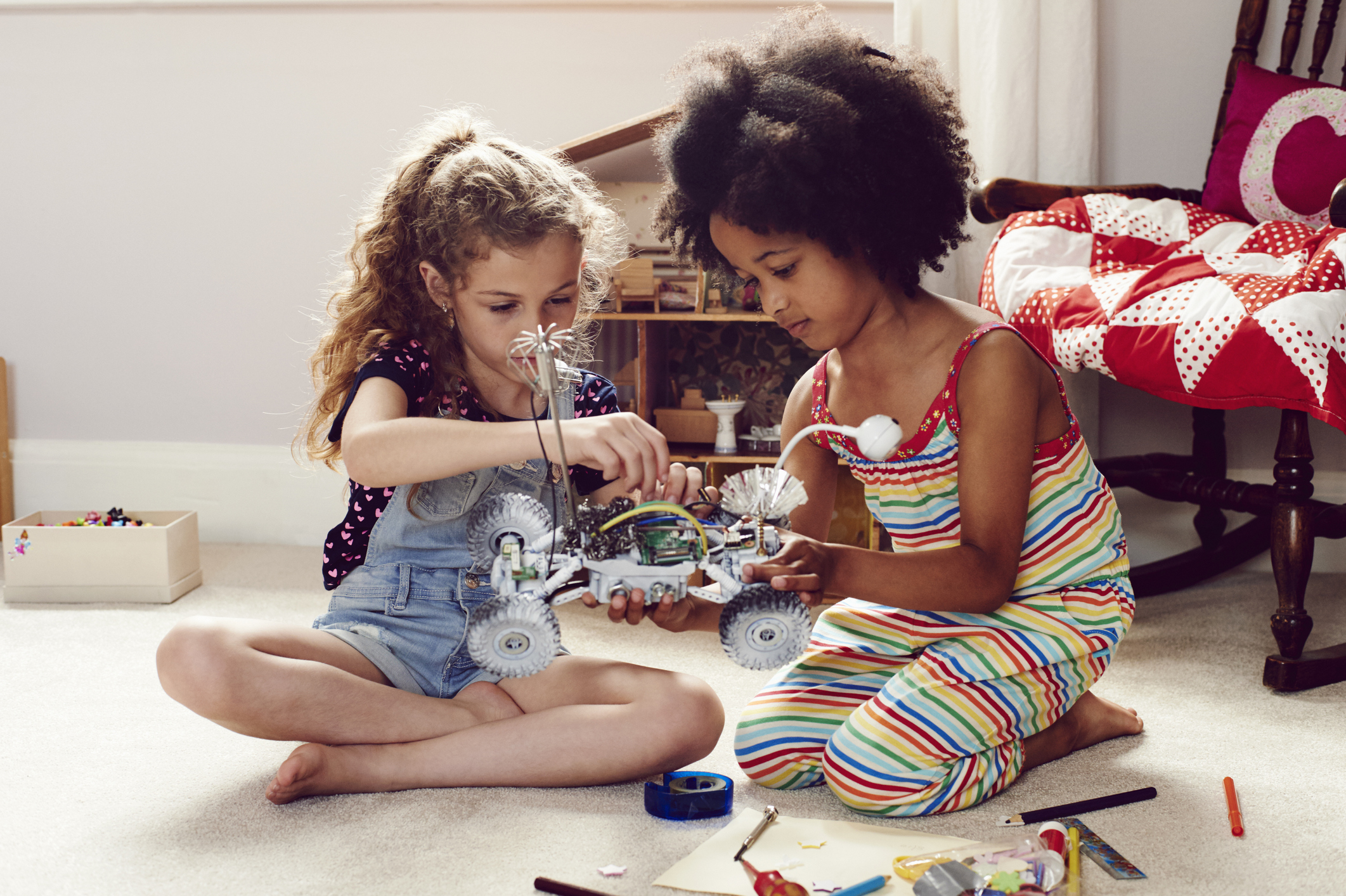 Two children working together to make things