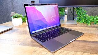 MacBook Pro 13-inch (M2, 2022) sitting on a desk —MacBook Pro 13-inch (M2, 2022)