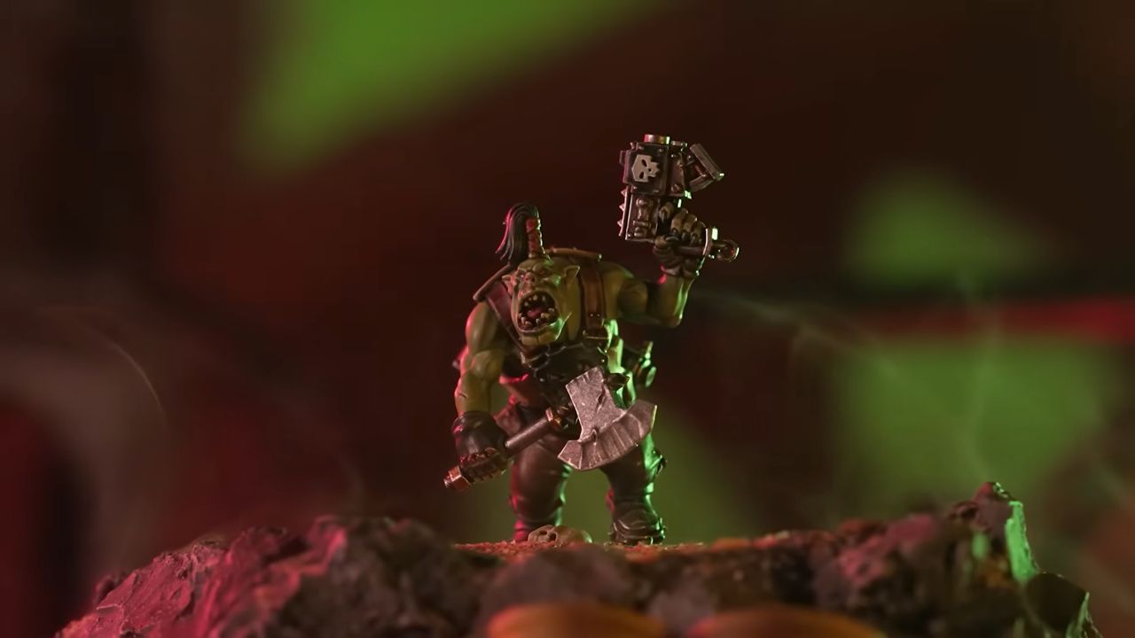 Warhammer Ork model on a dark, hazy battlefield