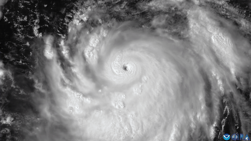 A GIF of lightning flashing around Hurricane Erin as the sun sets, taken from the GOES-19 satellite.