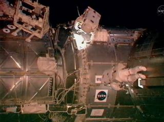Astronauts Drew Feustel and Greg Chamitoff conduct a variety of tasks on the exterior of the International Space Station. The duo performed the first of four planned spacewalks during Endeavour's 16-day mission.