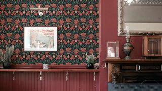 Fireplace alcove in red with floral wallpaper