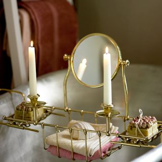 bathroom with golden colour bath rack and mirror