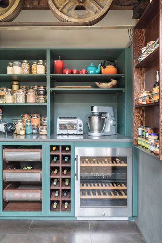 Pantry ideas featuring built-in wine fridge and space for large appliances