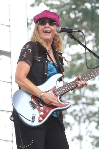 guitarist Debbie Davies is shown performing on stage during a "live" concert appearance on September 1, 2013.