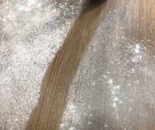 Brigii Handheld vacuum vacuuming flour off hard wood floor