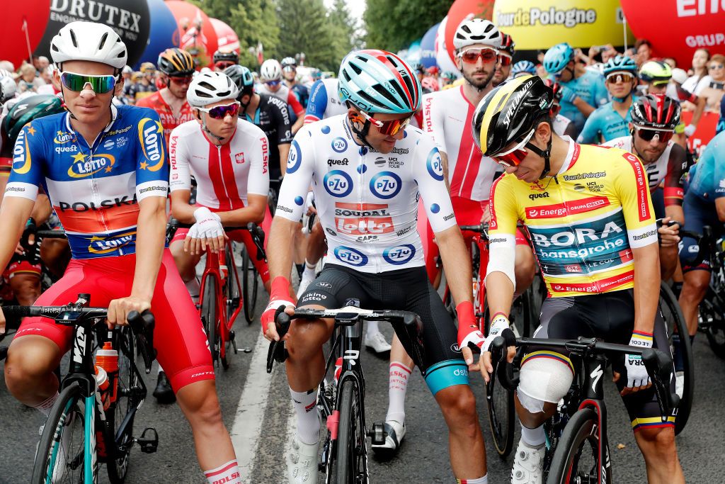 RZESZOW POLAND AUGUST 03 LR Patryk Stosz of Poland and Team Poland Blue Most Active Rider Jersey and Kamil Malecki of Poland and Team Lotto Soudal Polka Dot Mountain Jersey Sergio Andres Higuita Garcia of Colombia and Team Bora Hansgrohe Yellow Leader Jersey prior to the 79th Tour de Pologne 2022 Stage 5 a 1781km stage from Lancut to Rzeszow TdP22 WorldTour on August 03 2022 in Rzeszow Poland Photo by Bas CzerwinskiGetty Images