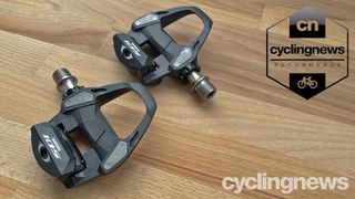 Shimano 105 Pedals overlaid with recommends badge