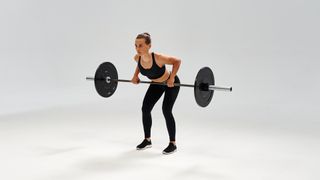 woman doing a bent over barbell row