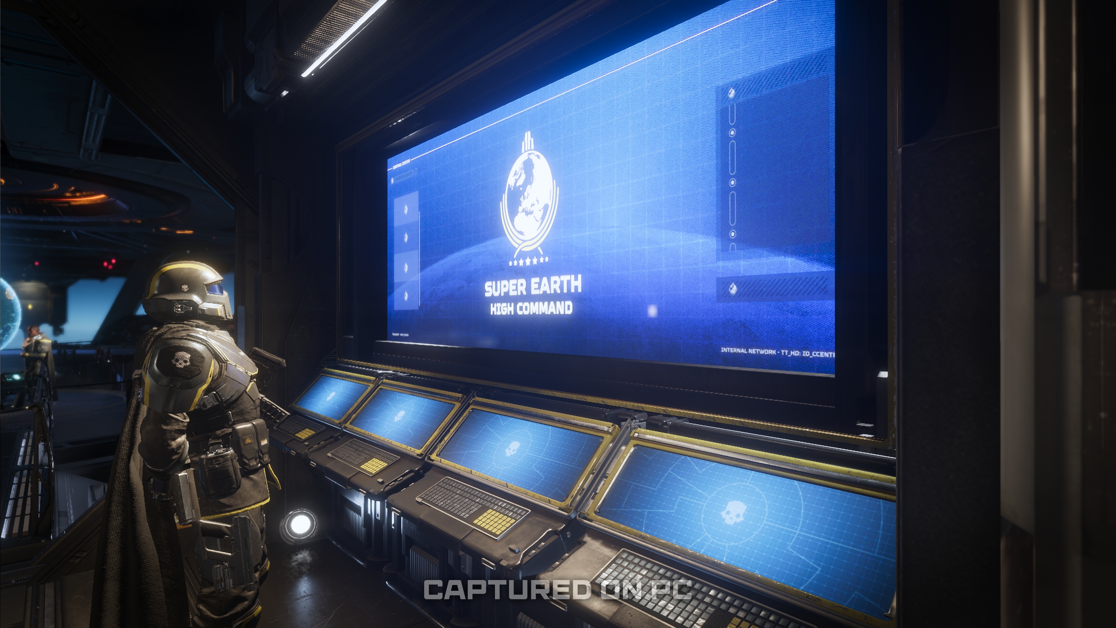 A Helldiver looks at a mission screen emblazoned with the text "Super Earth high command" in Helldivers 2.