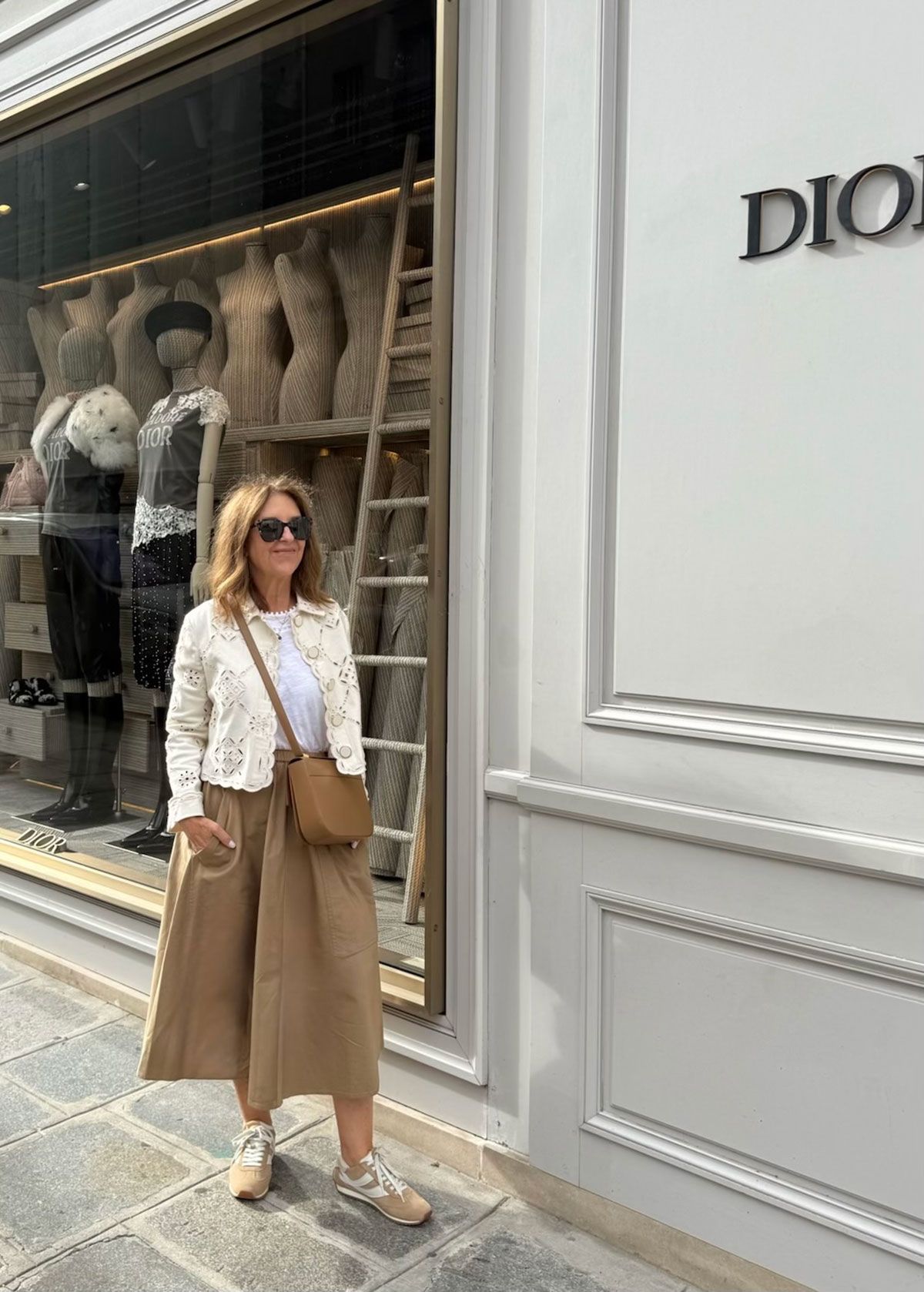 A Nordstrom stylist wearing sneakers in Paris.
