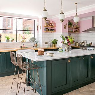green island with marble top and pink walls