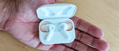 The Donner DoBuds One wireless earbuds held in reviewer's hand