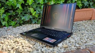 The MSI Raider 19 HX AI A2XW outside on white gravel
