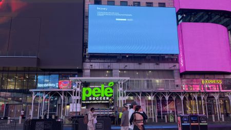 A digital billboard in New York's Time Square showing a blue screen of death due to the Crowdstrike outage of 2024.