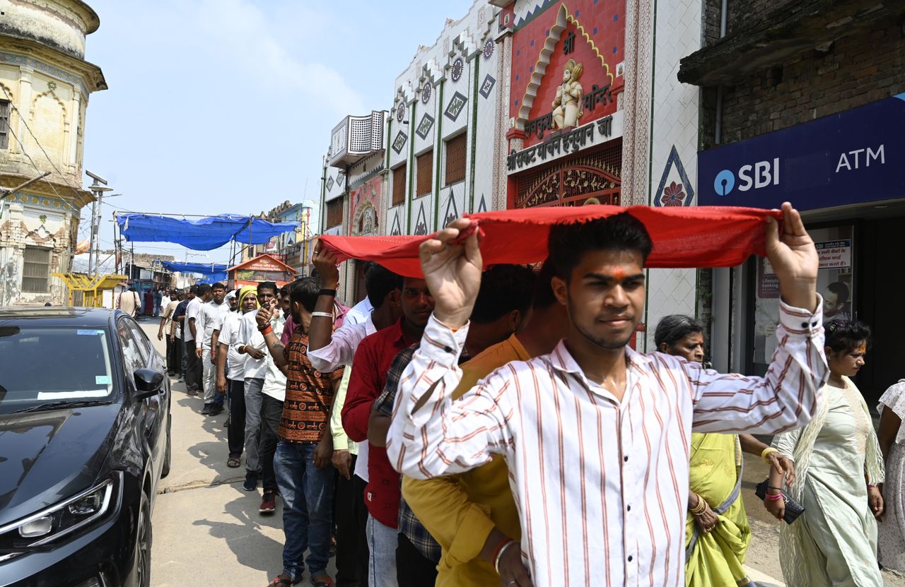 People form a line in India