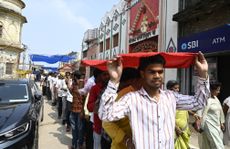 People form a line in India