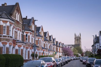 A residential street of Victorian-style terraced houses in London
