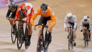 Netherlands' Harrie Lavreysen (C) competes to win Gold in the men's 15 km Keirin final at the UCI track cycling World Championship at the velodrome