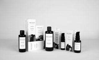 A display of Root Science skincare bottles and boxes