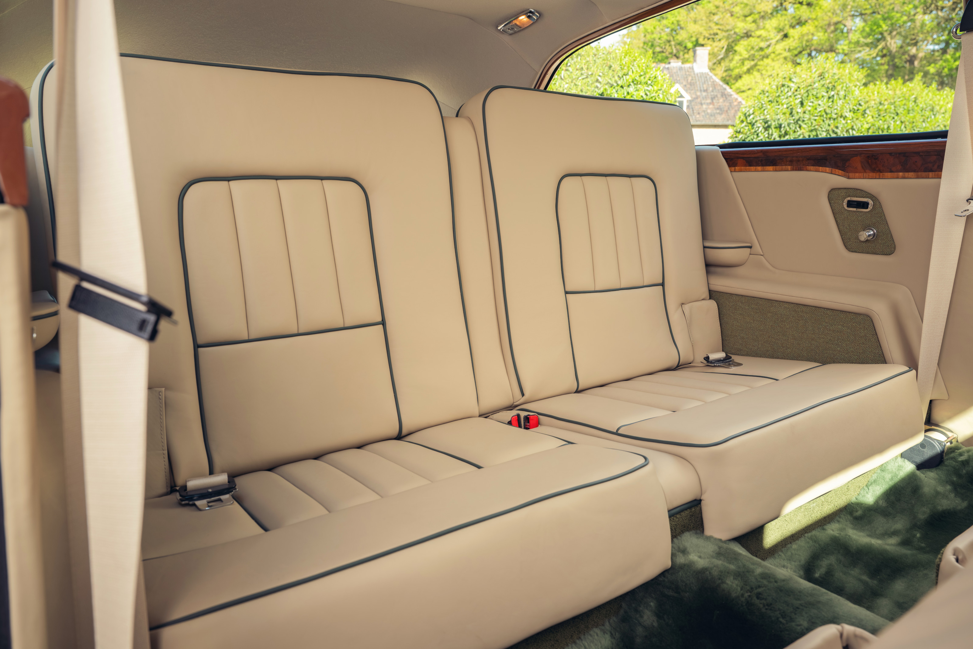 The rear seats, re-trimmed in beige leather...