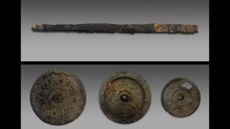An iron sword blade and several bronze mirrors.