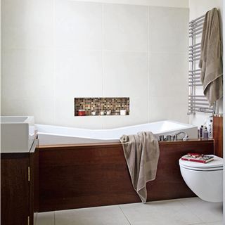 bathroom with bathtub and towel on rack