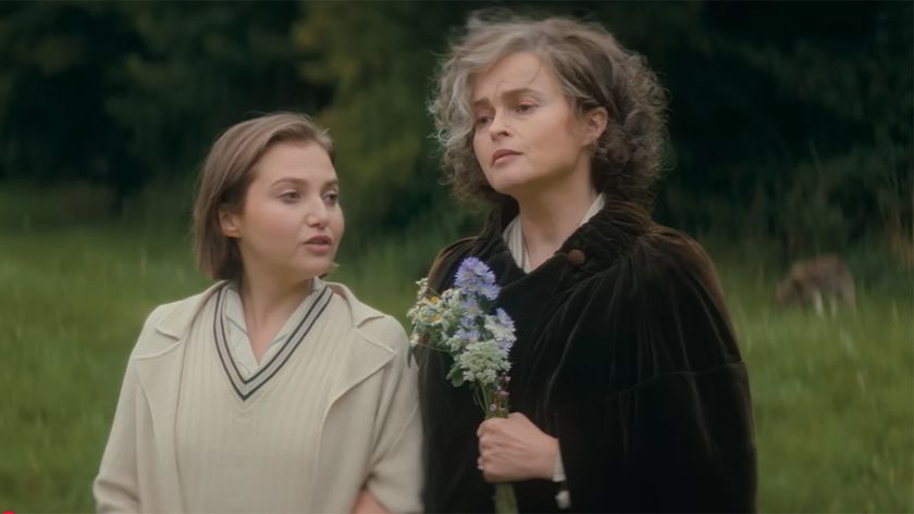 Bundle and her mom walk through the woods holding flowers in a scene from the 1920-set Seven Dials.