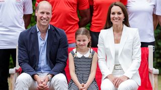 Prince William, Duke of Cambridge, Princess Charlotte of Cambridge and Catherine, Duchess of Cambridge smiling during a visit to SportsAid House