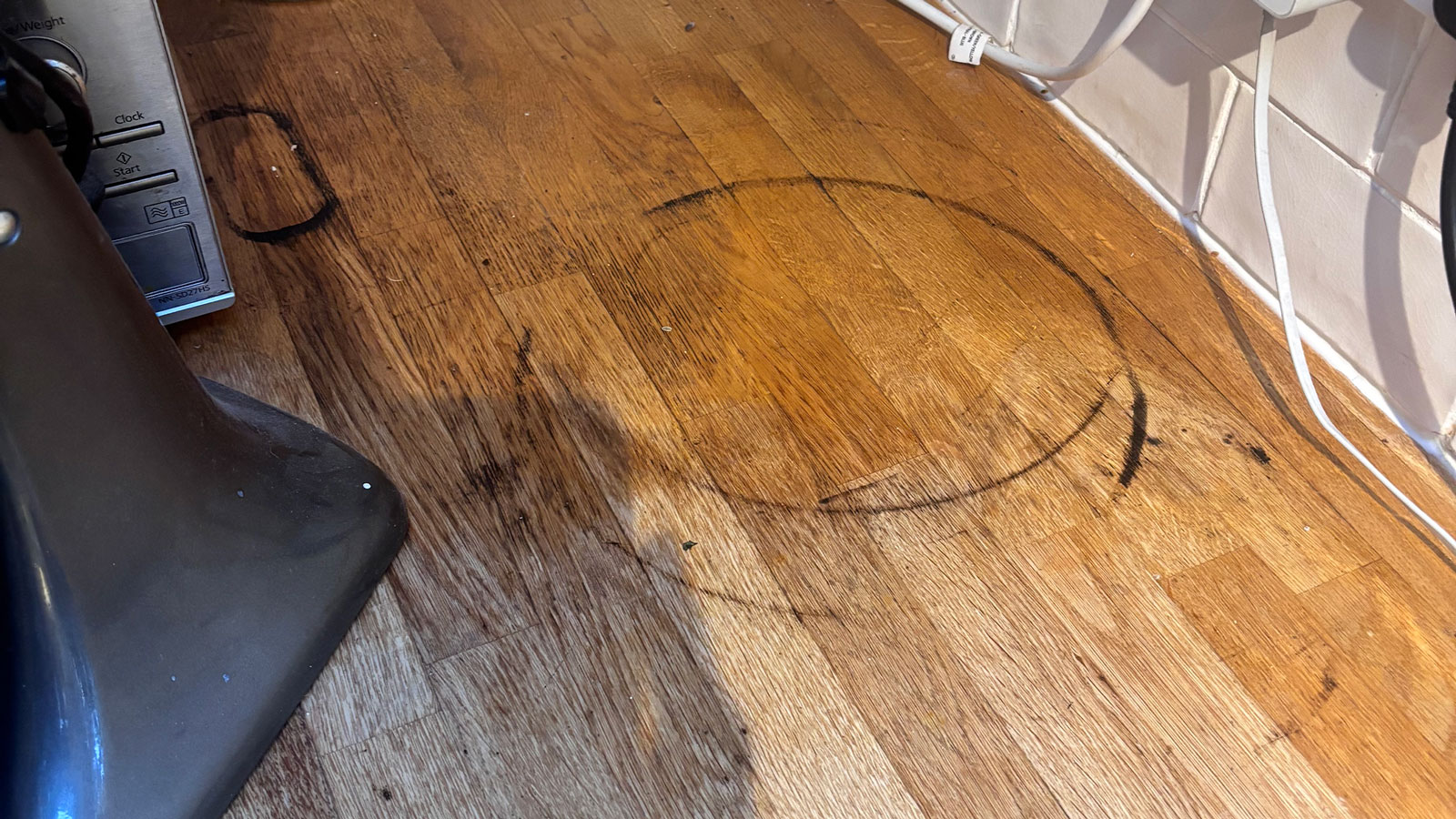 black rings on wooden worktop