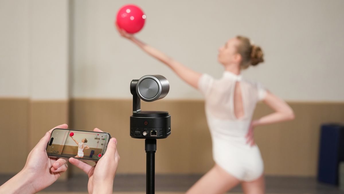 Obsbot Tail 2 camera being controlled by phone and pointing at dancer with red ball