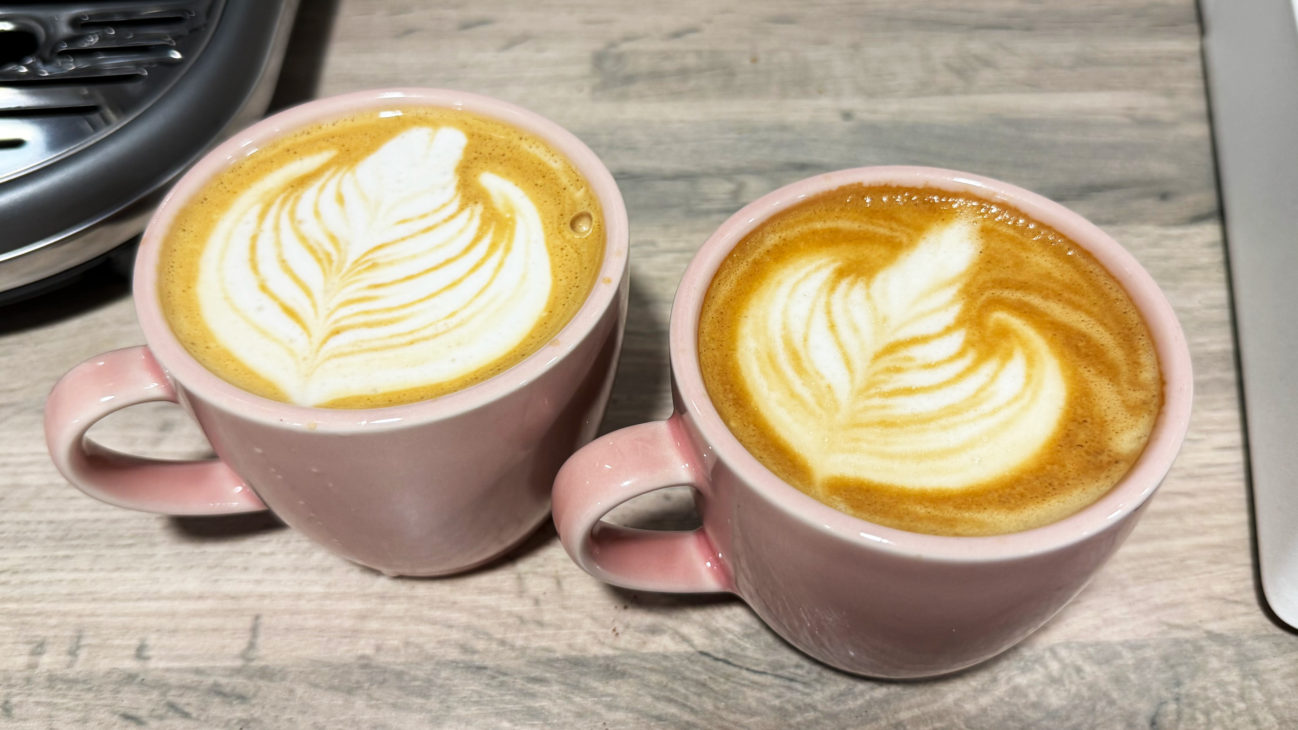 two flat whites made on the breville bambino and lelit mara x3