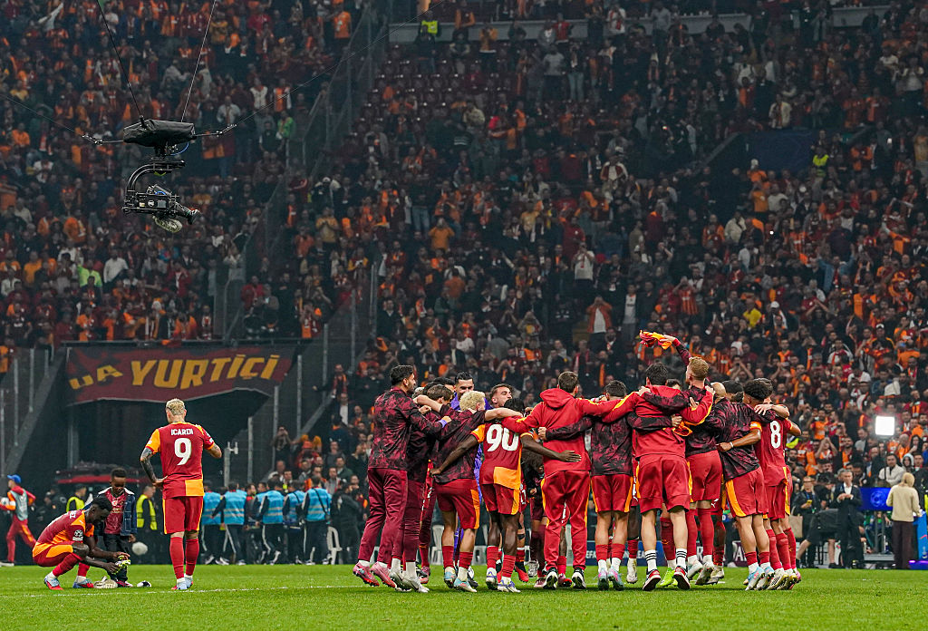 Galatasaray celebrate their victory over Liverpool with Davinson Sanchez and Mauro Icardi off to one side