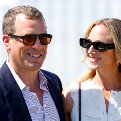 Peter Phillips and Harriet Sperling wearing sunglasses and smiling