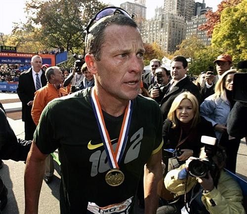 Lance Armstrong talks to the press after finishing his first marathon.