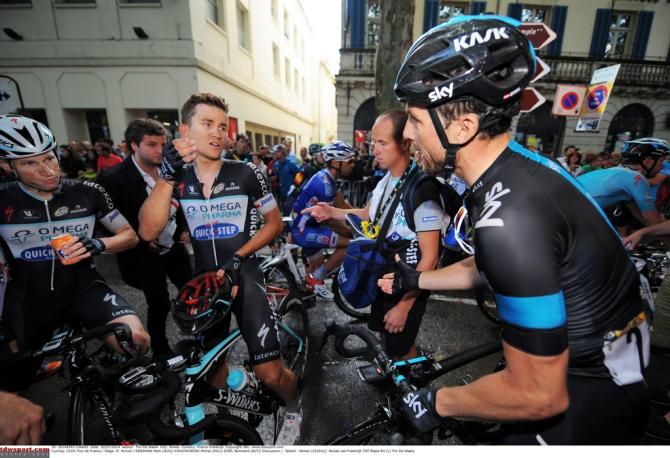 Bernie Eisel (Team Sky) in discussion with Michał Kwiatkowski and Mark Renshaw (Omega Pharma-Quick Step)
